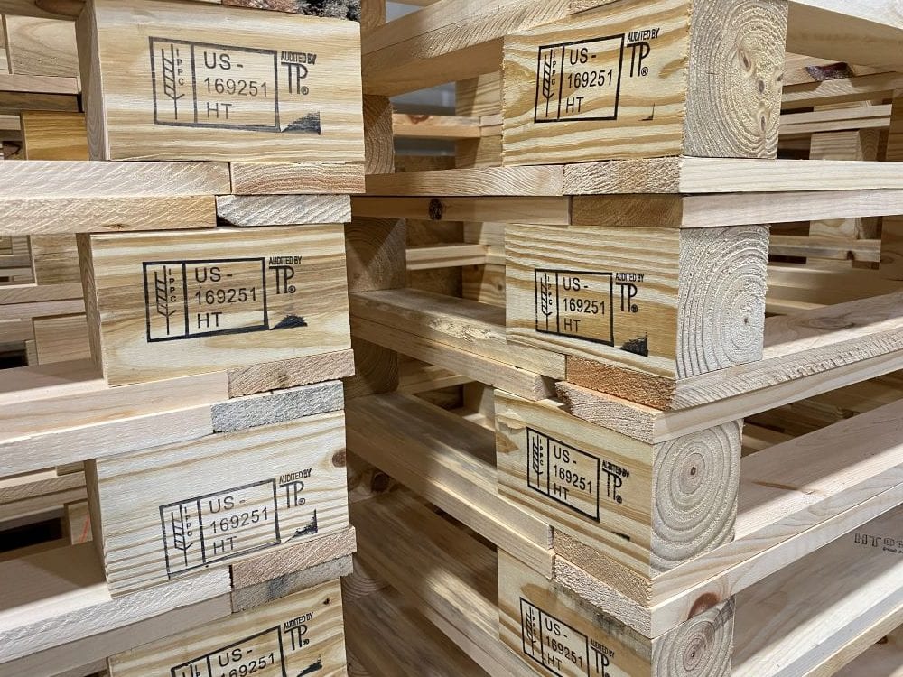 Stack of Pallets stamped with IPPC ISPM-15 Logo